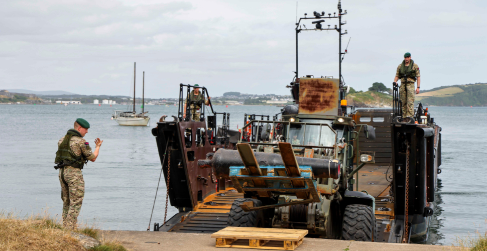 A Royal Marine boat delivers an historic cannon to Mount Edgcumbe in Cornwall